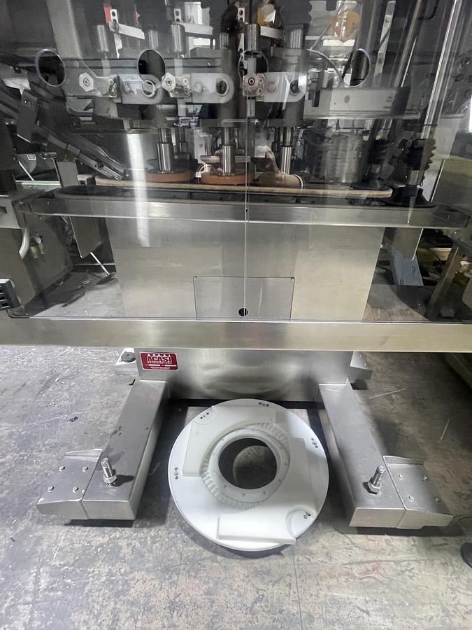 Used AUTOMATIC INLINE BOTTLE CAPPING MACHINE WITH VERTICAL WHEEL CAP SORTER