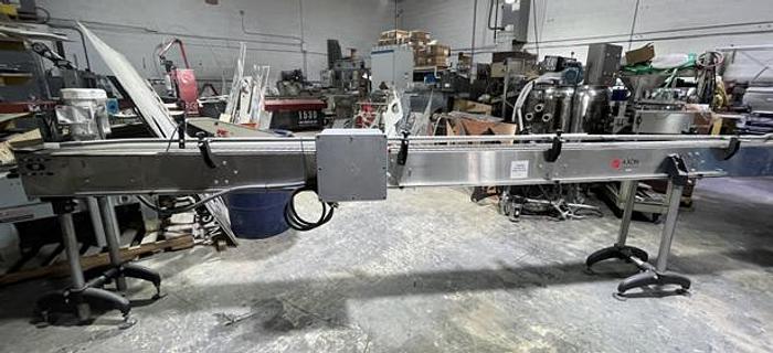 Used STAINLESS STEEL FRAME AND CHAIN-AXON CONVEYOR 15 FEET LONG 7.5 INCHES WIDE AND READY FOR SHIPMENT