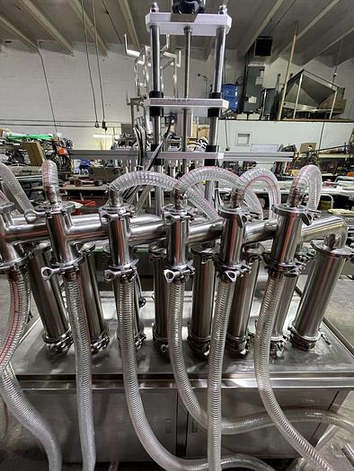 Used FULLY AUTOMATIC PISTON FILLING MACHINE WITH 8 FILLING NOZZLES -READY FOR SHIPMENT