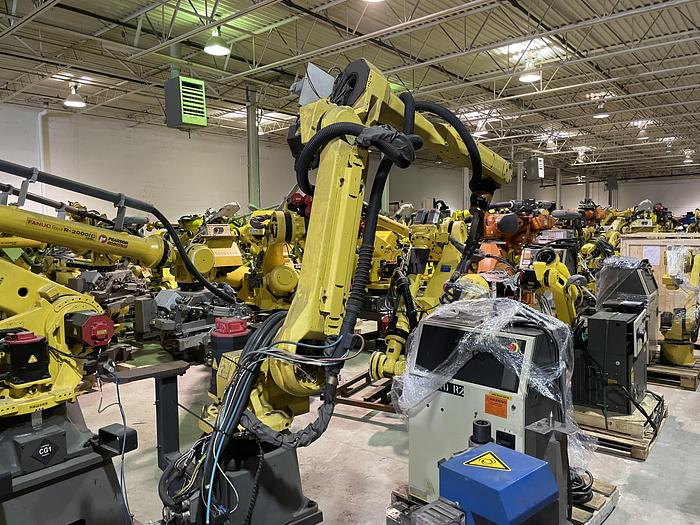 Used FANUC ARCMATE 120iC/10L MIG WELDING CELL WITH 2 AXIS 10' LONG DROP CENTER TRUNNION W/ROTARY CNC TABLE