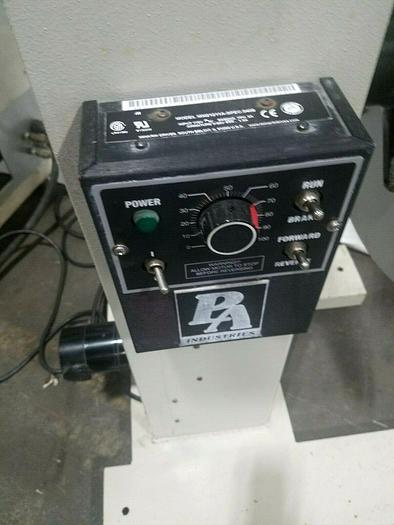 Used PA Industries Double Coil Motorized Stock Reel with Paper Interleaf Payoff Feed