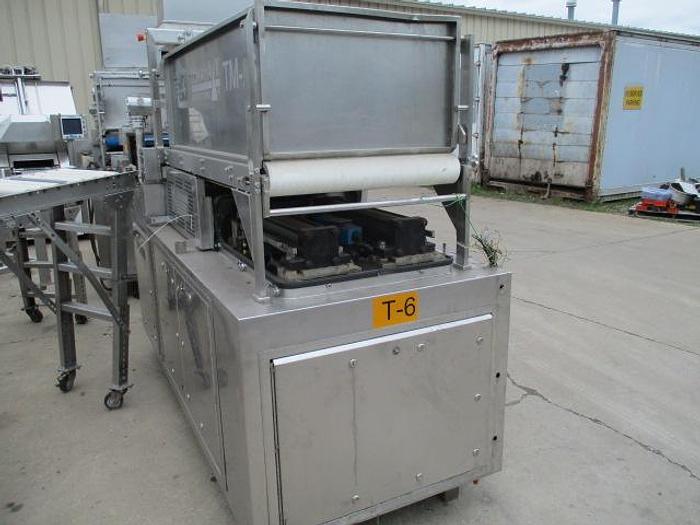 Used TOMAHAWK HIGH SPEED FORMING MACHINE WITH PAPER FEED AND SOFT FEED FILL SYSTEM TM-26