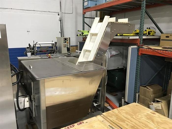 Used Omega model 2DJH bottle unscrambler