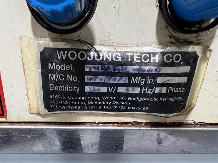Used Woojung Model Tubefil-1000 Plastic Tube Filler and Sealer