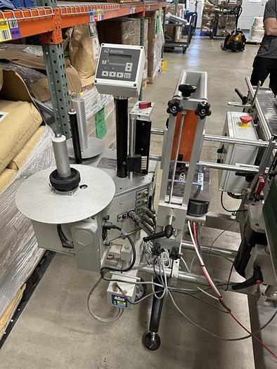 Used Quadrel model Moduline pressure sensitive wraparound labeler