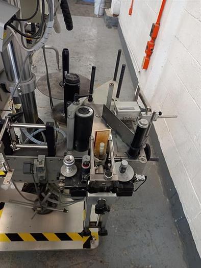 Used Kalish stainless steel  model  6801 wraparound pressure sensitive labeler