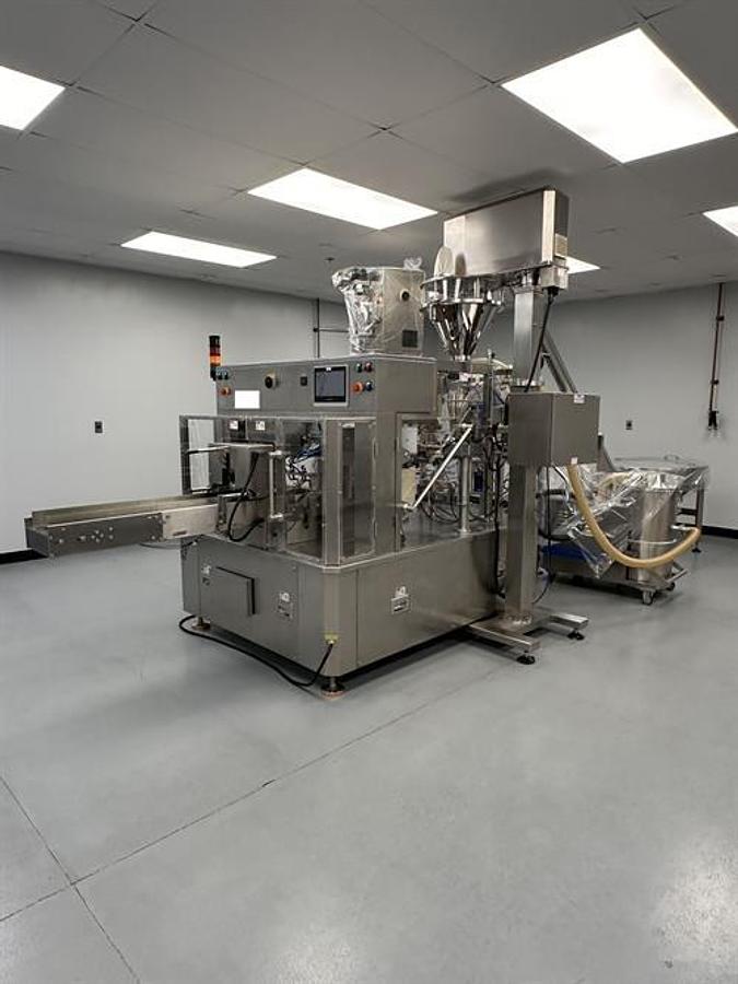 Used New Genesis Pre-Made Rotary Bagger With Auger Filler And Desiccant & Pouch Feeders