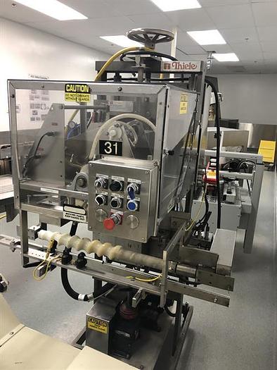 Used Thiele model 34-000 4-Head Rotary Placer with Nordson Hot Melt