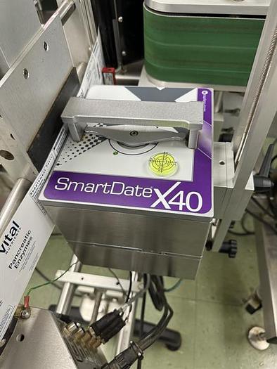 Used Quadrel model Moduline pressure sensitive wraparound labeler