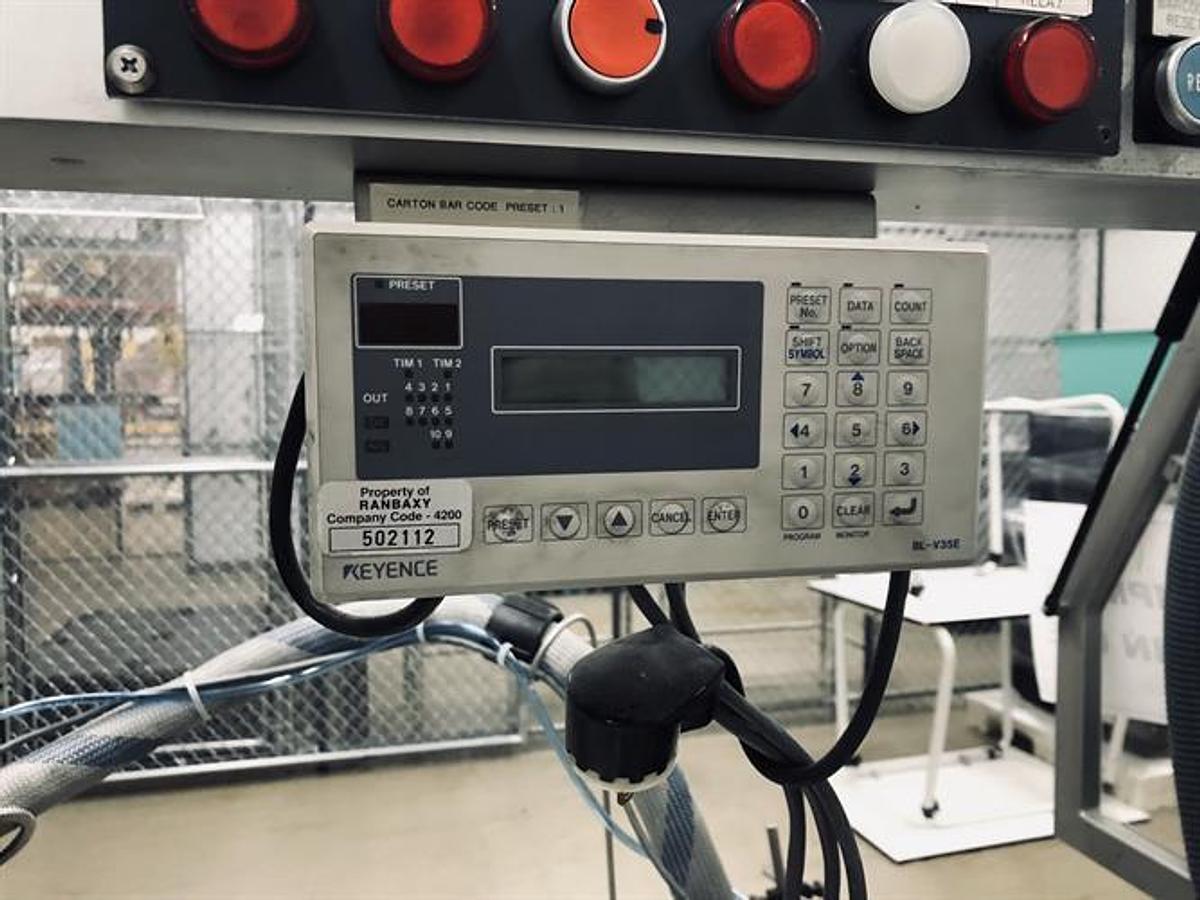 Used CAM model AV06 semi-automatic vertical glue cartoner