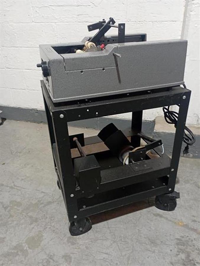 Used Advent model 310 semi-automatic pressure sensitive wraparound labeler