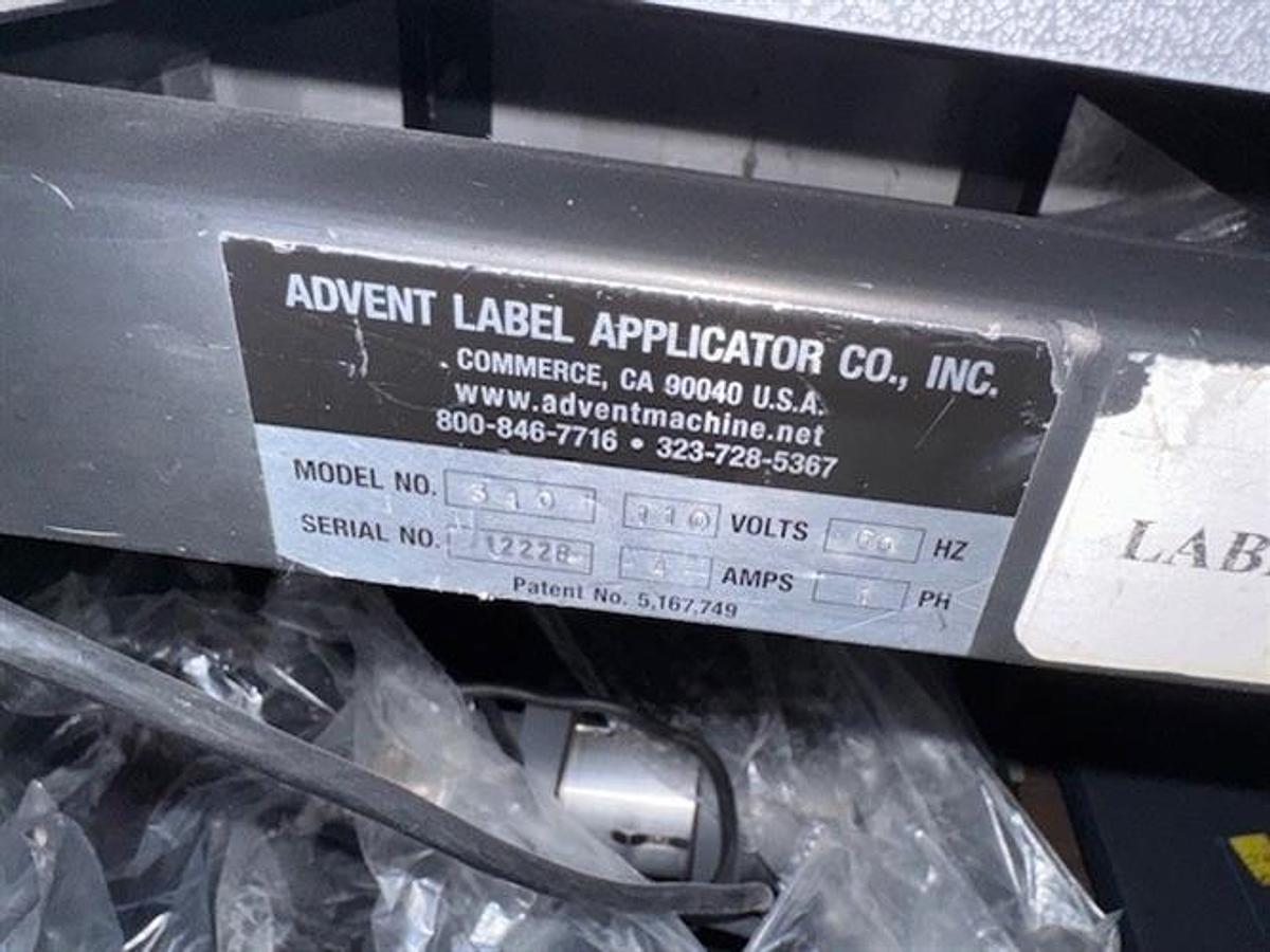 Used Advent model 310 semi-automatic pressure sensitive wraparound labeler