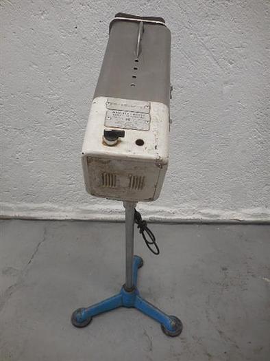 Used Manesty stainless steel table deduster.