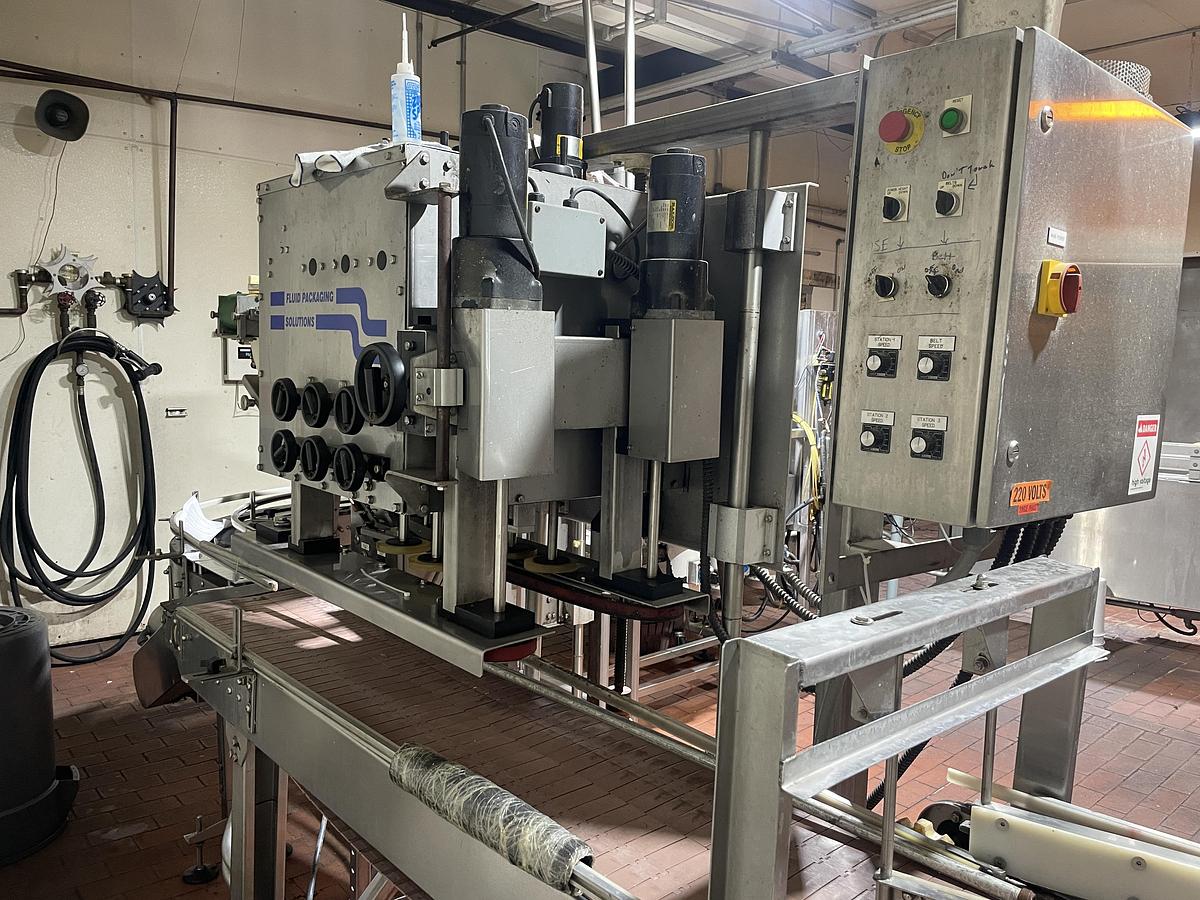 Used Fluid Packaging Solutions 6 Spindle Capper