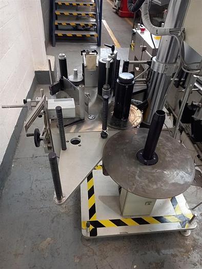 Used Kalish stainless steel  model  6801 wraparound pressure sensitive labeler