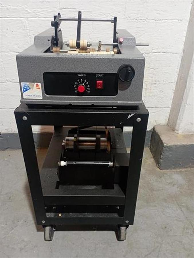 Used Advent model 310 semi-automatic pressure sensitive wraparound labeler