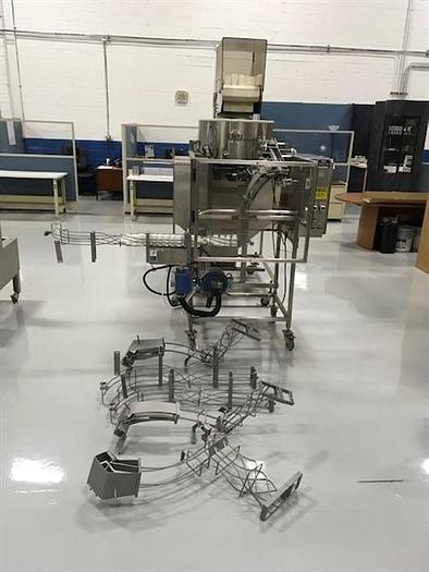 Used Omega model 2DJH bottle unscrambler