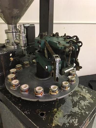 Used Kalix model KX-60 16-Station Tube filler and sealer