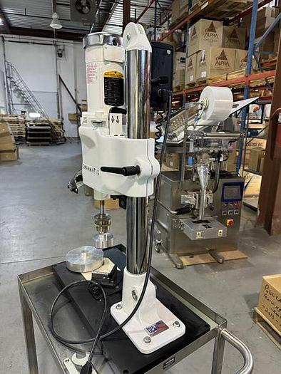 Used Swanmatic model C300 Cap Master semi-automatic capper