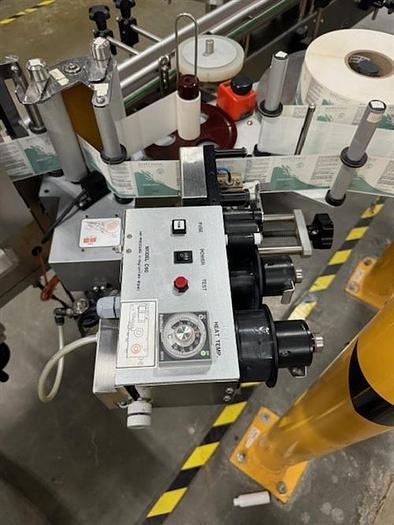 Used CVC model 300 wraparound pressure sensitive labeler with 28" accumulating table