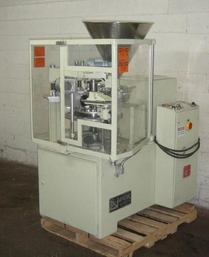 Used UNIPAC COMBIMATIC 12-STATI.PLAST.TUBE FILLER -