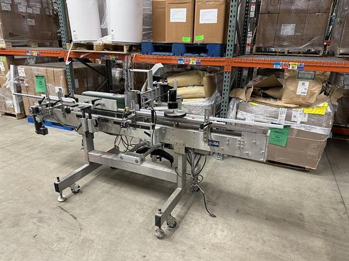 Used Quadrel model Moduline pressure sensitive wraparound labeler