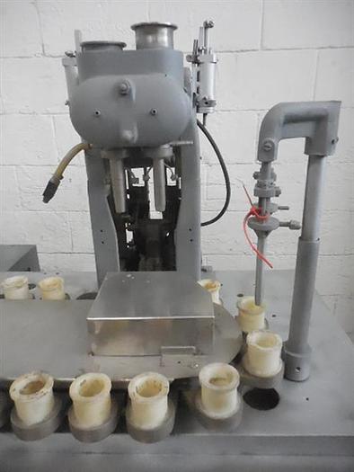 Used Arenco semiautomatic tube filler.