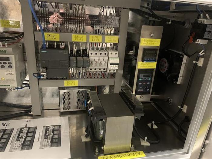 Used Saturn LAWA-A Wraparound Labeler with Accumulating Table