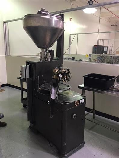 Used Kalix model KX67B 16-Station Tube filler and sealer