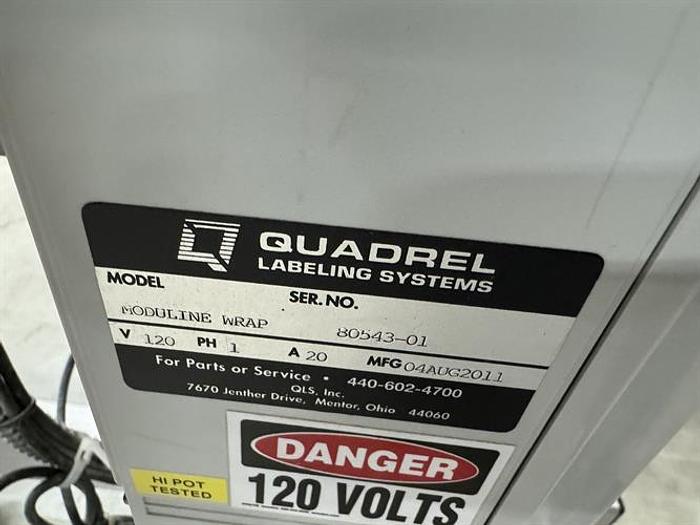 Used Quadrel model Moduline pressure sensitive wraparound labeler