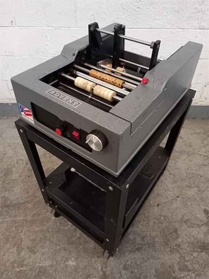 Used Advent model 310 semi-automatic pressure sensitive wraparound labeler