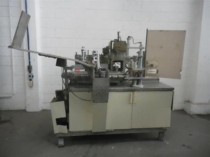 Used Arencomatic model 1000 semiautomatic tube filler.