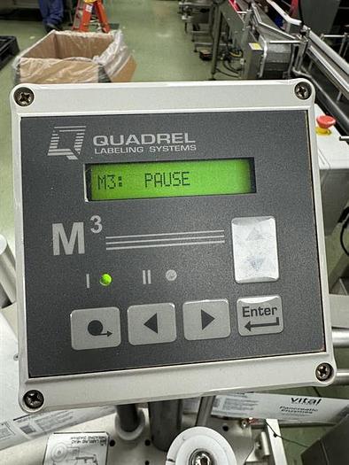 Used Quadrel model Moduline pressure sensitive wraparound labeler