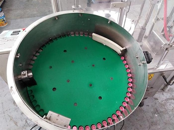 Used Capmatic Patriot FC21 monoblock filler and capper