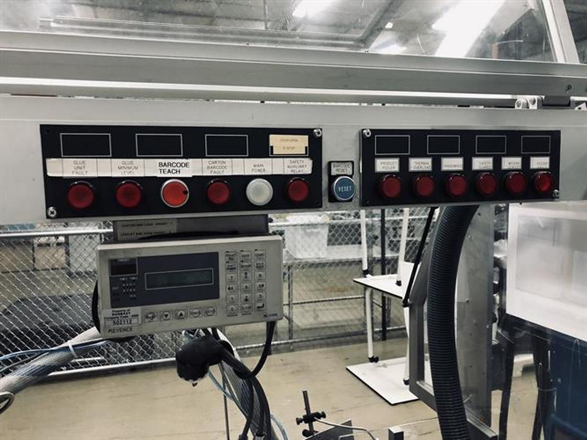 Used CAM model AV06 semi-automatic vertical glue cartoner