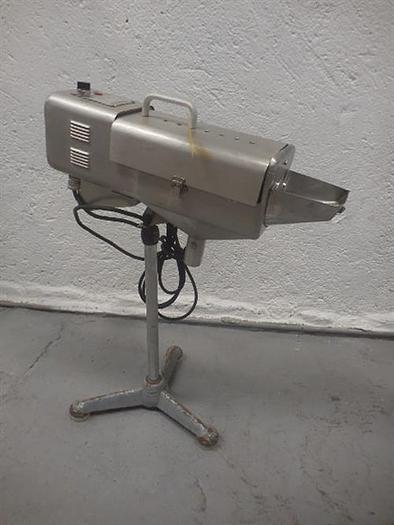 Used Manesty stainless steel table deduster.