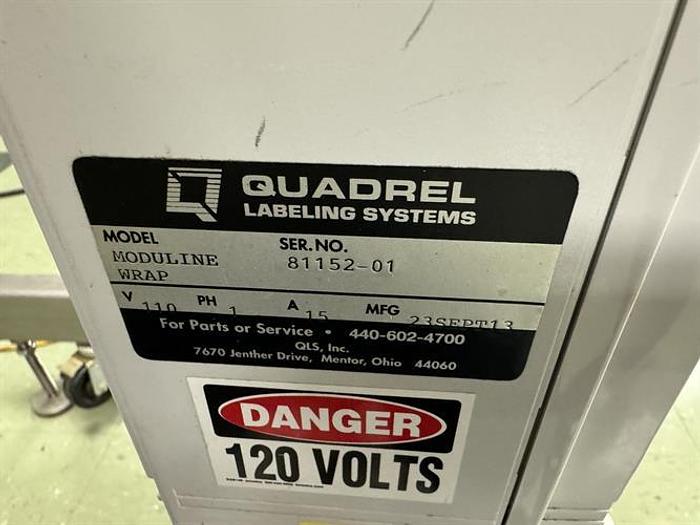 Used Quadrel model Moduline pressure sensitive wraparound labeler