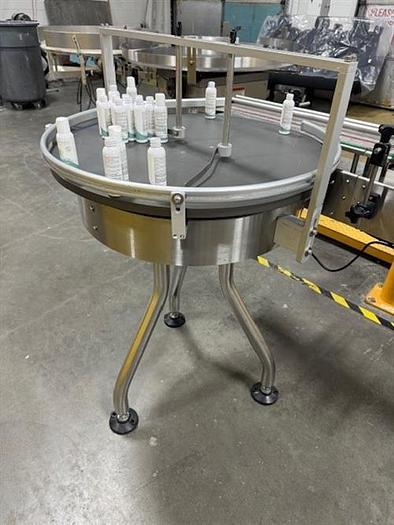 Used CVC model 300 wraparound pressure sensitive labeler with 28" accumulating table