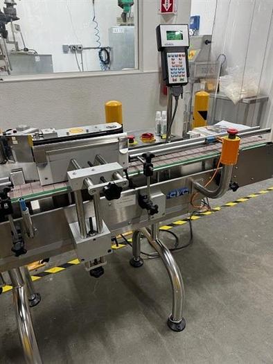 Used CVC model 300 wraparound pressure sensitive labeler with 28" accumulating table