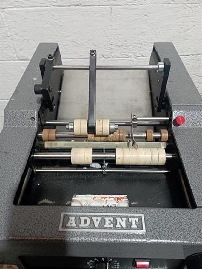 Used Advent model 310 semi-automatic pressure sensitive wraparound labeler