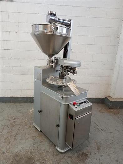 Used Kalix model KX60 metal tube filler & sealer