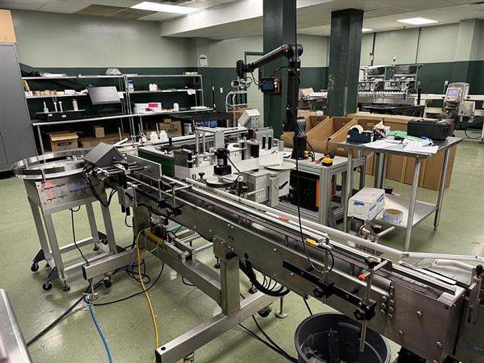 Used Quadrel model Moduline pressure sensitive wraparound labeler