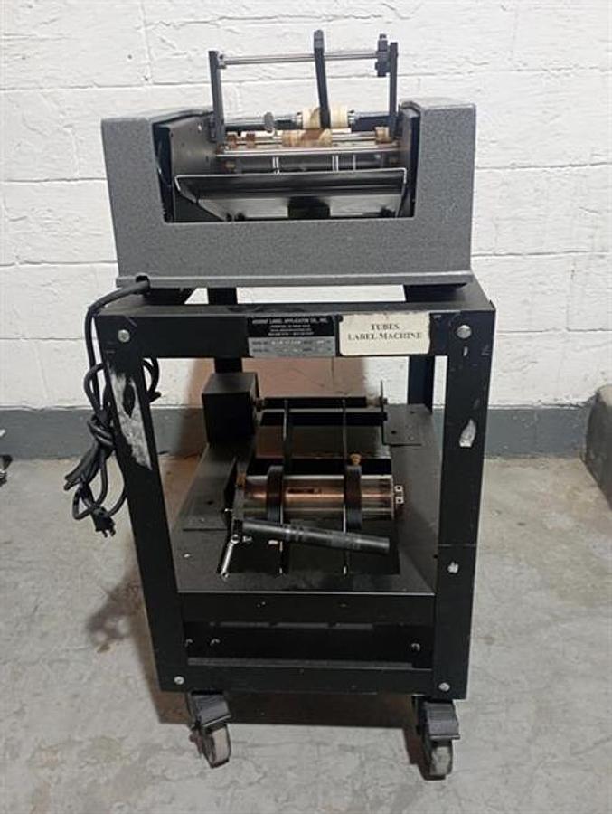 Used Advent model 310 semi-automatic pressure sensitive wraparound labeler
