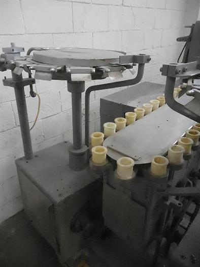 Used Arenco semiautomatic tube filler.