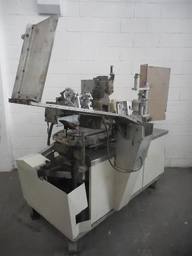 Used Arencomatic model 1000 semiautomatic tube filler.