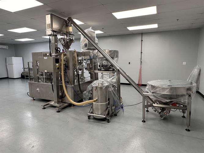 Used New Genesis Pre-Made Rotary Bagger With Auger Filler And Desiccant & Pouch Feeders