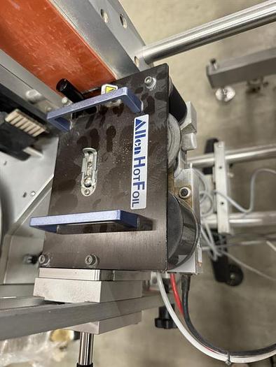 Used Quadrel model Moduline pressure sensitive wraparound labeler