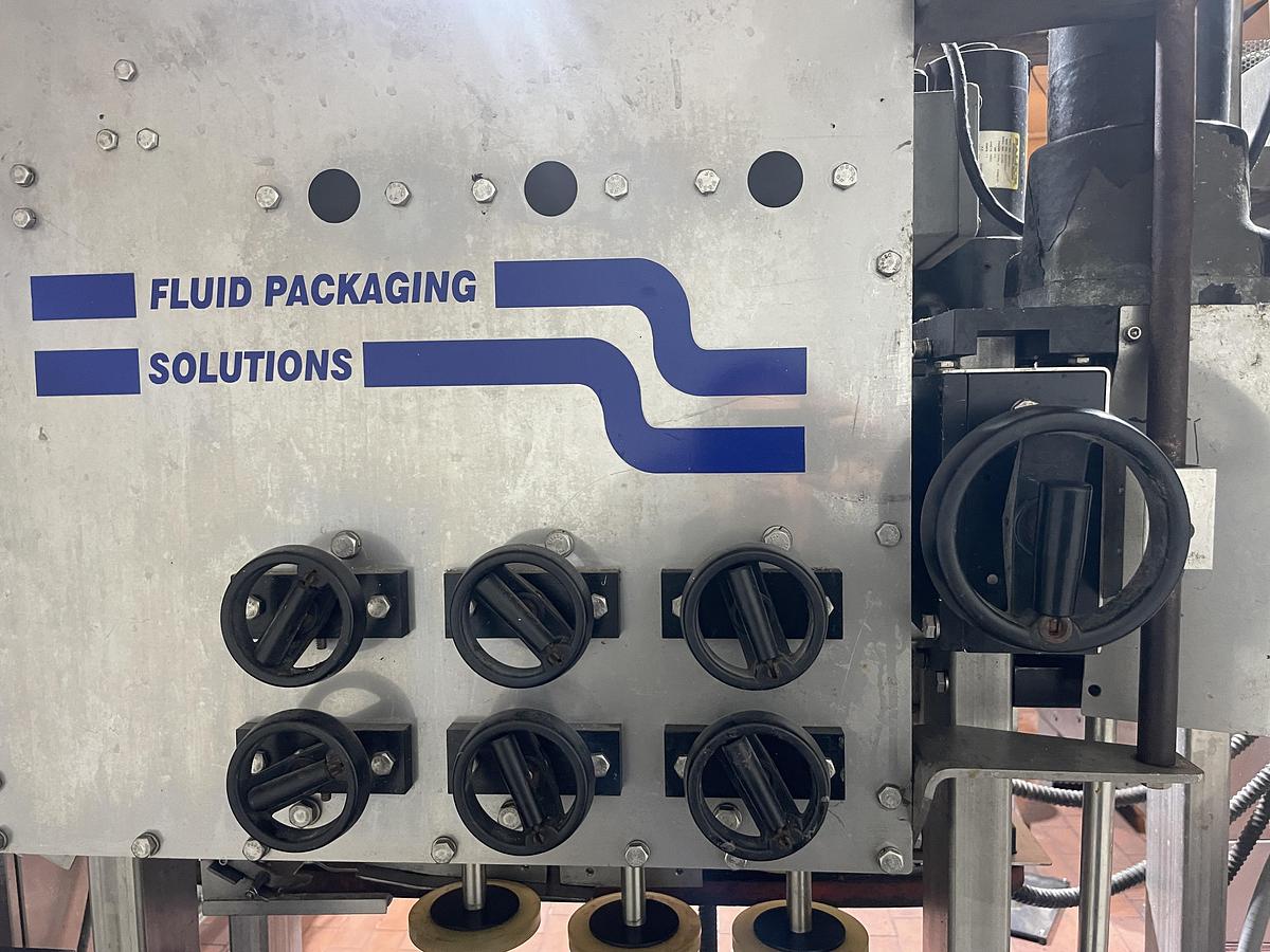 Used Fluid Packaging Solutions 6 Spindle Capper