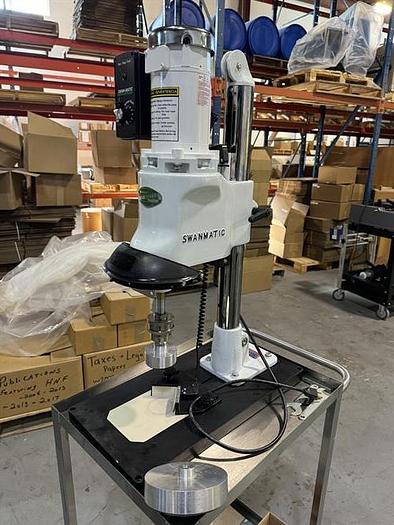Used Swanmatic model C300 Cap Master semi-automatic capper