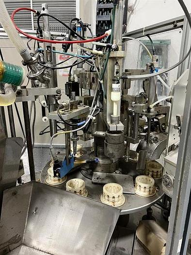 Used Woojung Model Tubefil-1000 Plastic Tube Filler and Sealer